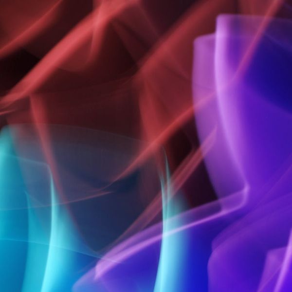 Abstract swirling lines of light symbolizing energy and flow.